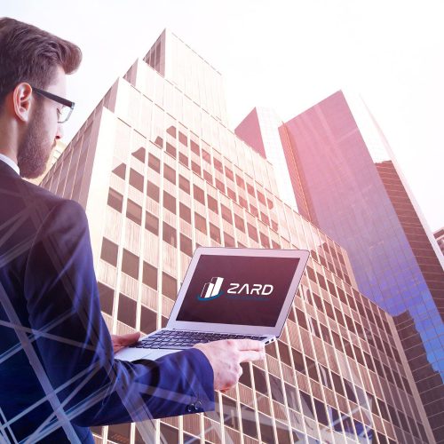man-using-laptop-city-zard